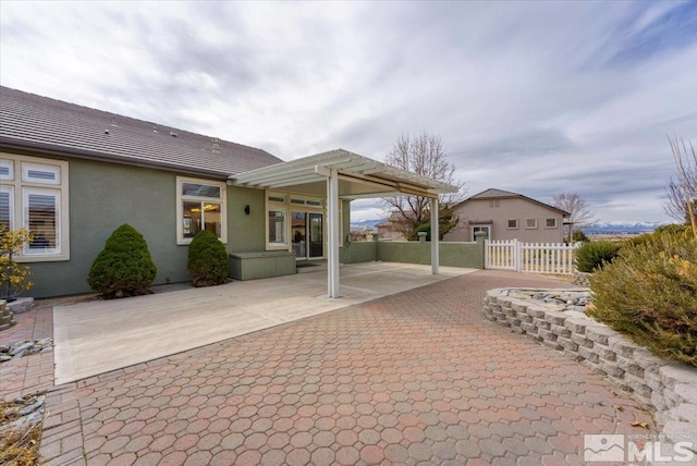 view of patio with fence and a pergola