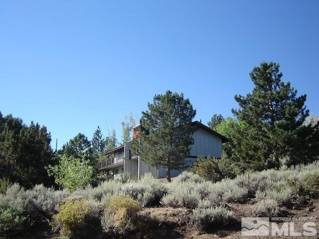 view of property exterior featuring a chimney