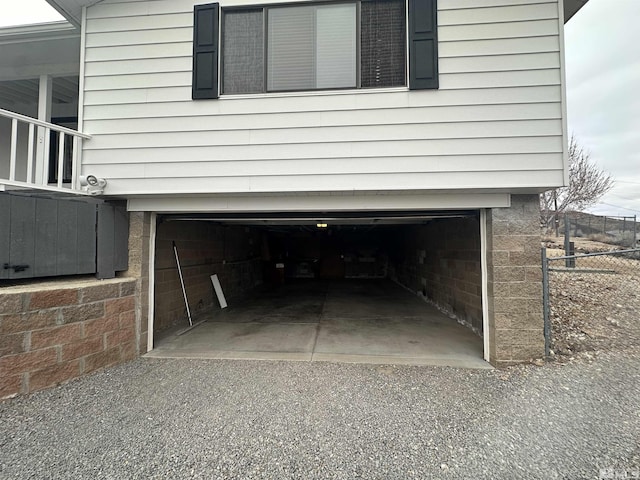 exterior space with a garage and fence