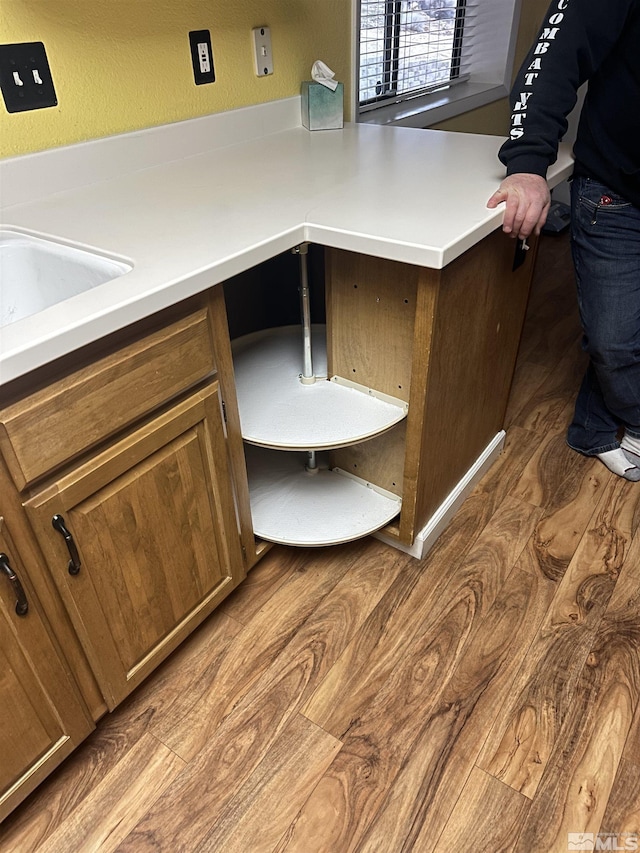 kitchen featuring light countertops and wood finished floors