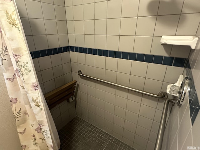 full bathroom with a tile shower