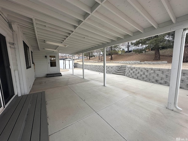 view of patio / terrace featuring an outdoor structure and a storage unit