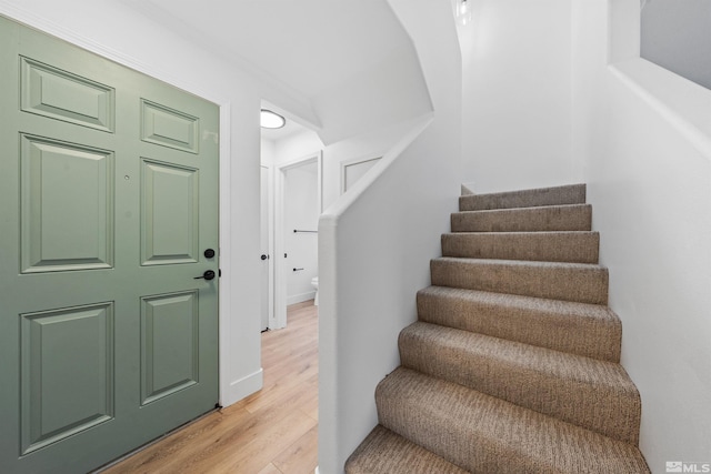 stairs with wood finished floors