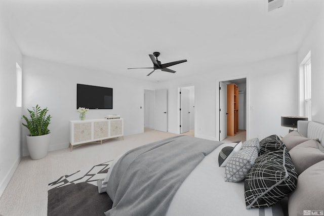 bedroom featuring carpet floors, baseboards, visible vents, and ceiling fan