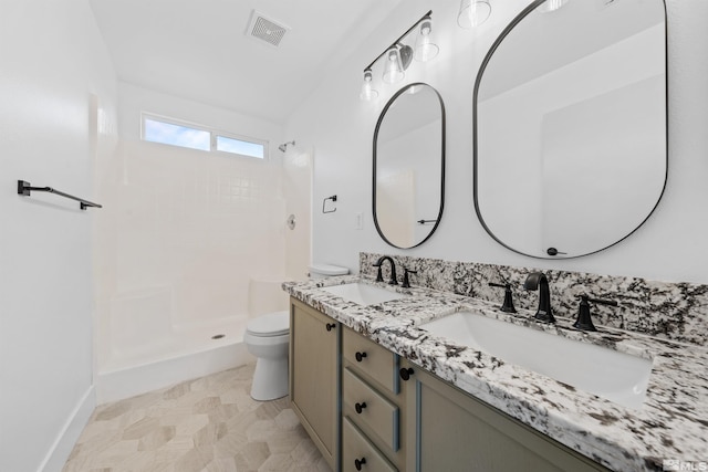 full bath featuring visible vents, a sink, toilet, and walk in shower