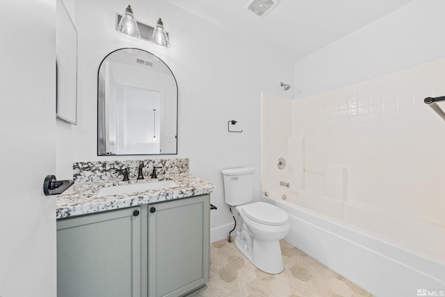 bathroom with shower / bathtub combination, toilet, vanity, visible vents, and baseboards