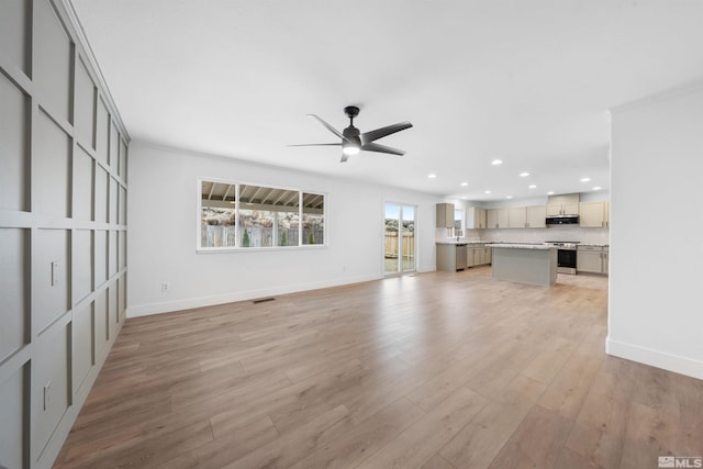 unfurnished living room with baseboards, recessed lighting, visible vents, and light wood-style floors