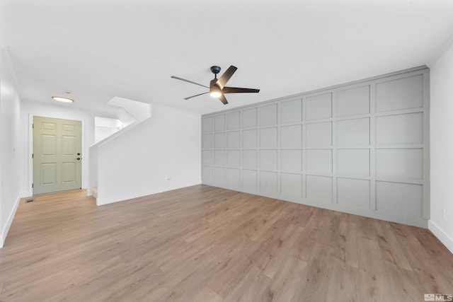 unfurnished living room with ceiling fan and light wood finished floors