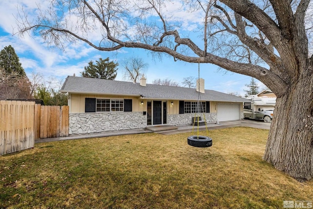 ranch-style home featuring a garage, fence, stone siding, a front lawn, and a chimney