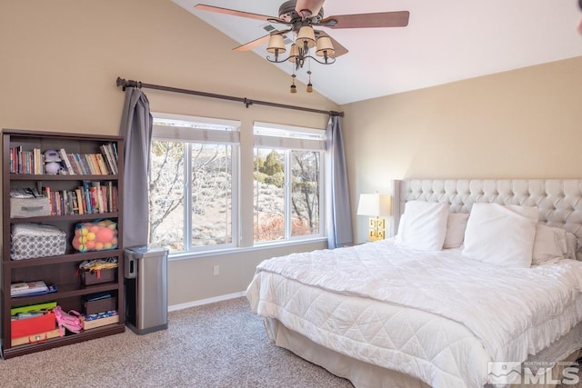 bedroom featuring carpet floors, vaulted ceiling, baseboards, and ceiling fan