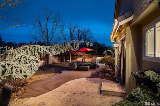 view of property exterior with a patio area, outdoor lounge area, and a fenced backyard