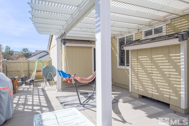 view of patio / terrace with fence and a pergola