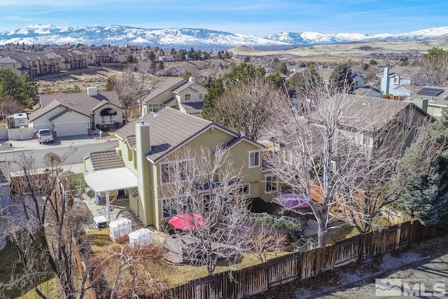 drone / aerial view with a residential view and a mountain view