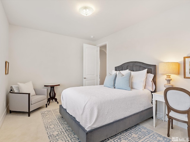 bedroom with baseboards and carpet flooring