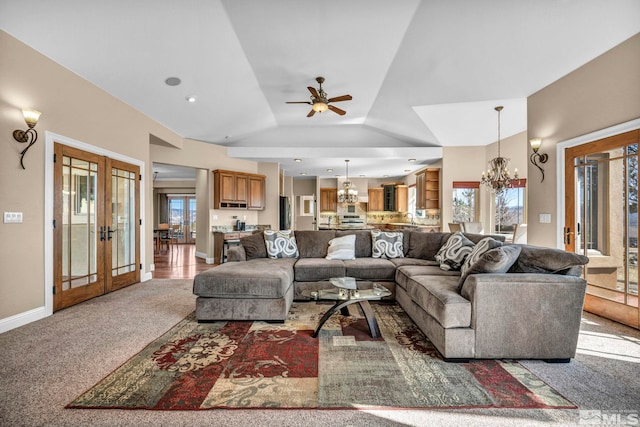 living room with plenty of natural light, carpet, french doors, and vaulted ceiling