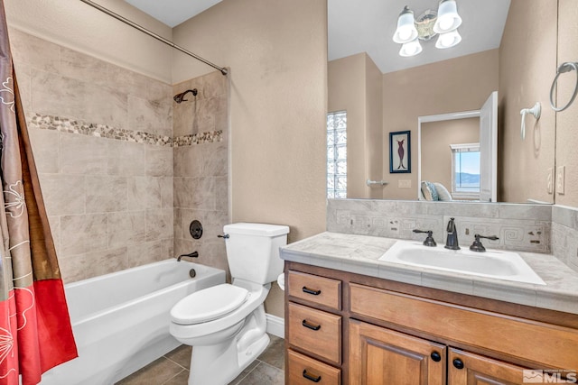 full bath with tile patterned flooring, shower / tub combo with curtain, vanity, and toilet