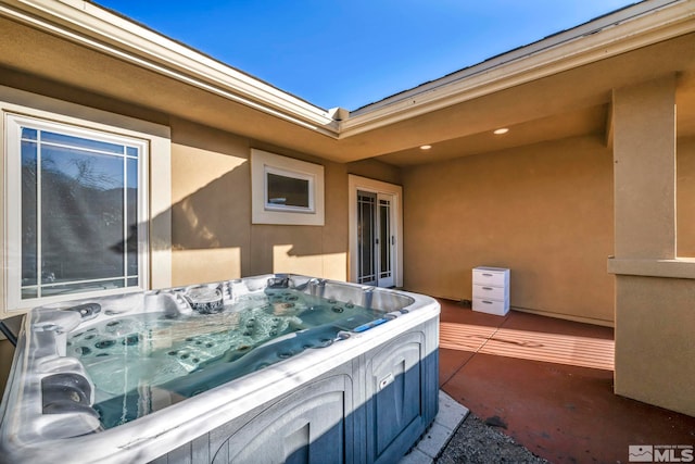 view of patio / terrace featuring a hot tub