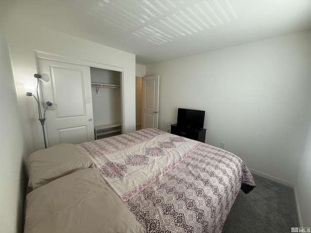 bedroom featuring a closet, carpet flooring, and baseboards