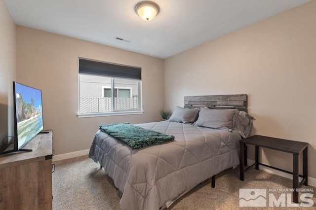 bedroom featuring visible vents, carpet floors, and baseboards