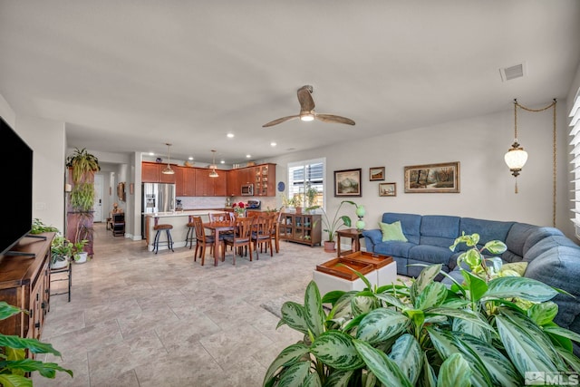 living room featuring recessed lighting, visible vents, and ceiling fan