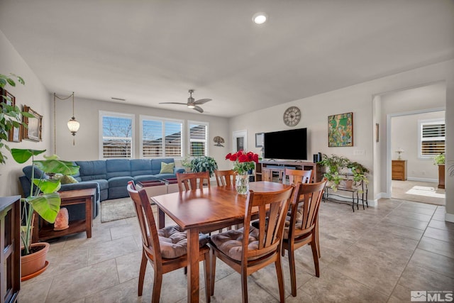 dining space with a ceiling fan, recessed lighting, light tile patterned flooring, and baseboards