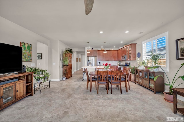 dining space with ceiling fan, baseboards, and recessed lighting