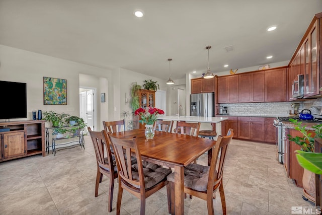 dining space featuring recessed lighting