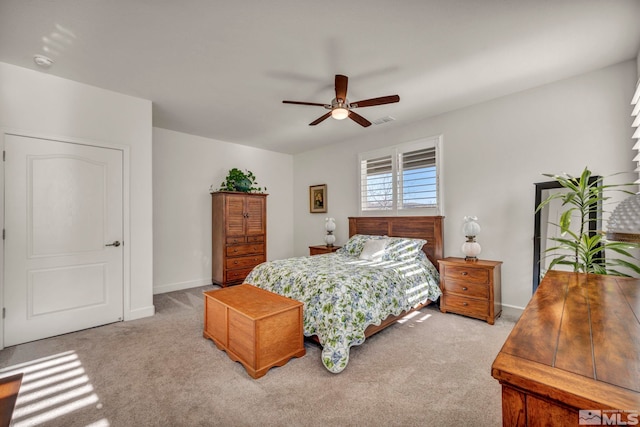 bedroom with ceiling fan, carpet, visible vents, and baseboards