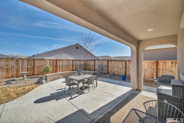 view of patio / terrace with outdoor dining area and a fenced backyard