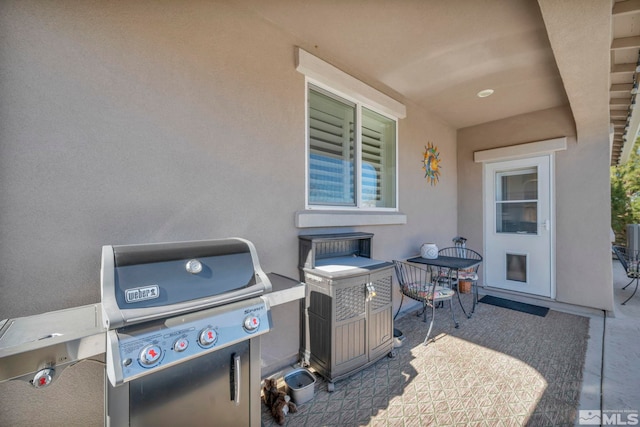 view of patio featuring a grill