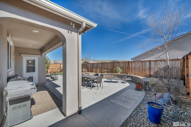 view of patio / terrace with a fenced backyard and outdoor dining space