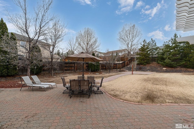 view of patio / terrace featuring fence private yard and outdoor dining area