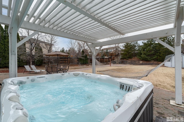 view of pool with a patio, a pergola, fence, and a hot tub