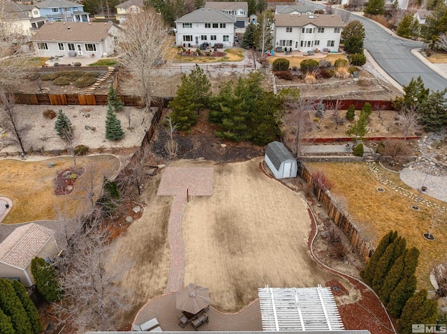 birds eye view of property with a residential view