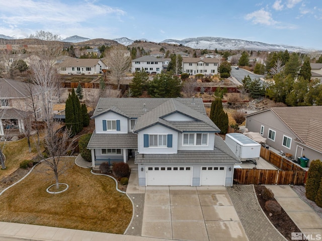 birds eye view of property with a residential view and a mountain view