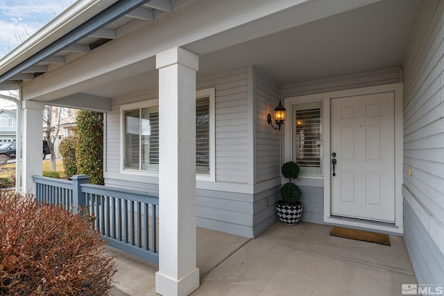 view of exterior entry featuring a porch