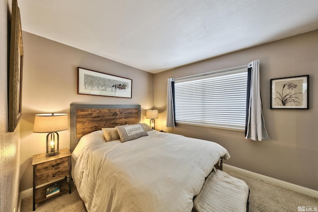 carpeted bedroom with baseboards