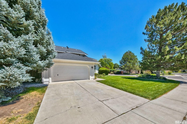 view of side of home with a garage, concrete driveway, a lawn, and stucco siding