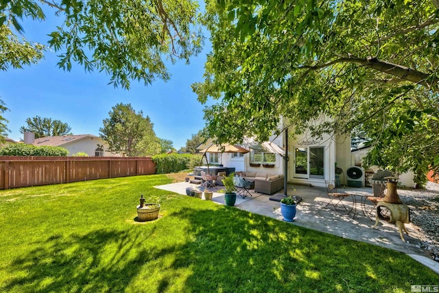 view of yard with a patio, outdoor lounge area, and a fenced backyard