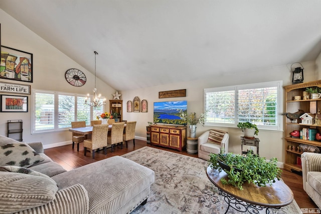 living room with high vaulted ceiling, baseboards, an inviting chandelier, and wood finished floors