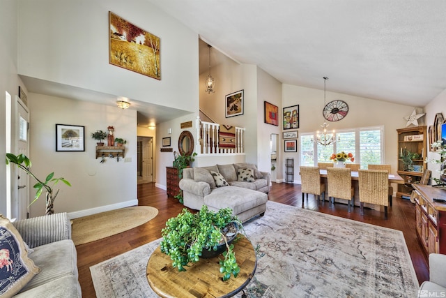 living area with a chandelier, high vaulted ceiling, dark wood-style flooring, and baseboards