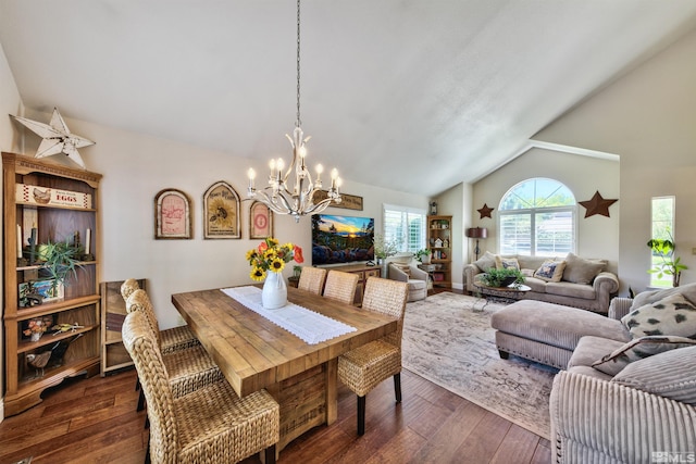 dining space with dark wood-style flooring, a notable chandelier, and vaulted ceiling