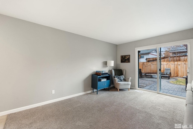 sitting room with carpet floors and baseboards