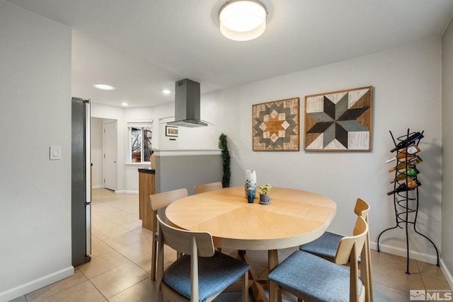 dining space with recessed lighting, baseboards, and light tile patterned floors