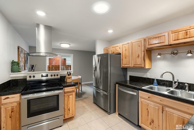 kitchen with tile countertops, stainless steel appliances, light brown cabinets, a sink, and island range hood