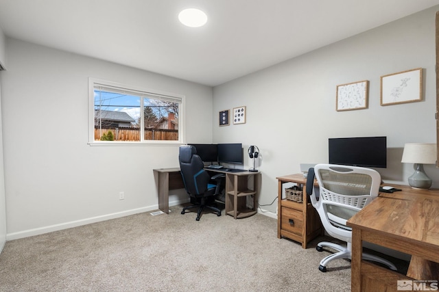 office space with carpet and baseboards