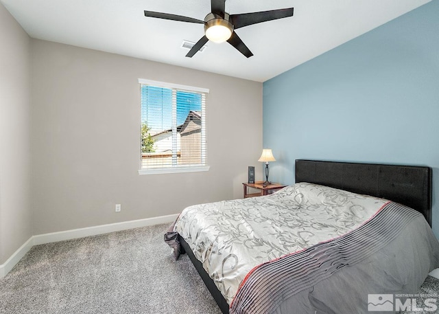 carpeted bedroom with a ceiling fan, visible vents, and baseboards