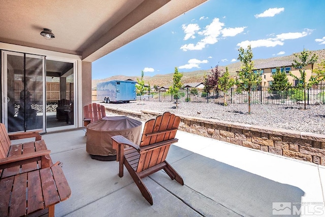 view of patio / terrace featuring a residential view and fence