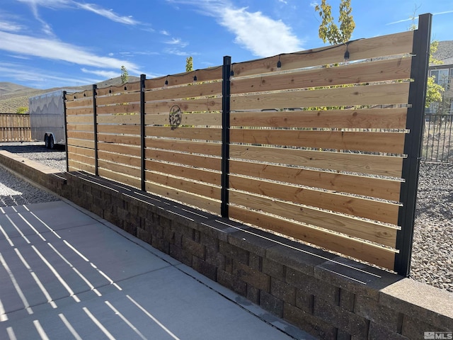 view of gate featuring fence