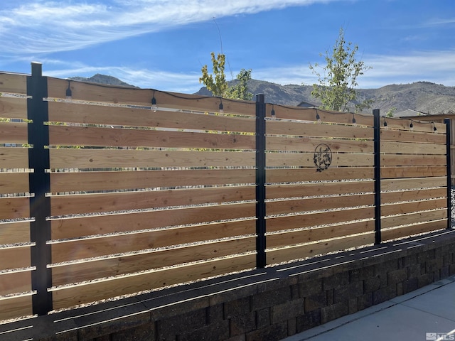 view of gate with a mountain view